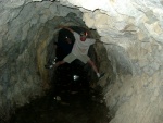 ...same tunnel, with a flash.  The floor was wet, so Brandon found a way to keep his feet dry.