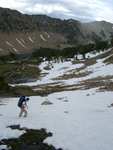 Stephen crossing a small snow field on the way to our camp.  Lake Washington in the background.