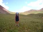 Mayela in the meadow, still pretty high up.  The pass we came over to get here is in the background.  Beautiful country.