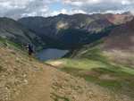 Mayela heading down the trail, just after the pass.  Snowmass lake is visible below us.