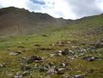 A picture of the rock-strewn alpine meadow just below Trail Rider pass.