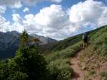 Mayela passing the last tree as we climb toward the ridge.