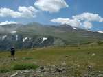 Mayela, heading across the plateau on day two.  Froze-to-Death mountain can be seen in the distance.