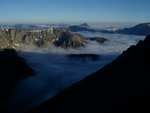 (1 of 4) On the side of Tempest, enroute to Granite.  This cloud-filled valley is where we've camped on previous trips.  Avalache and Snowball lakes are down there.