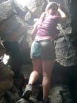 Mayela climbing down into a 3rd cave.