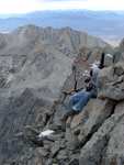 It got so cold that we climbed over the back (cliff face) side of the summit ridge to get out of the wind.  The ledge I was on here was about a foot wide, and I was tired enough that I actually dozed off for a minute or two.