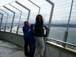 Mayela, mom, and dad trying to enjoy the wind on the Observation Deck.
