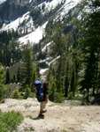 Climbing the ledge system beside Goat Falls, looking out over an unnamed lake.