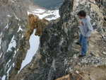Stephen looking down the sheer northeast wall toward no-name lake, 2000 feet below.
