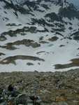 View of the lake basin and snow pack from about 10,300 feet.