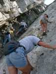 Tara and Mayela climbing along the rocks, while Olga and Brandon work their way up the crack.