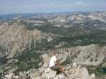 Nate, at the summit.  What a view ... and what a drop!