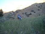 Heading through the deep grass toward the creek, about 1/2 mile from the trailhead.