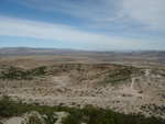Counter-clockwise panoramic shot #6.  The path crosses the picture, and stops at a little crucifix (the building near the water hole).